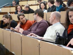 Students talking in an auditorium