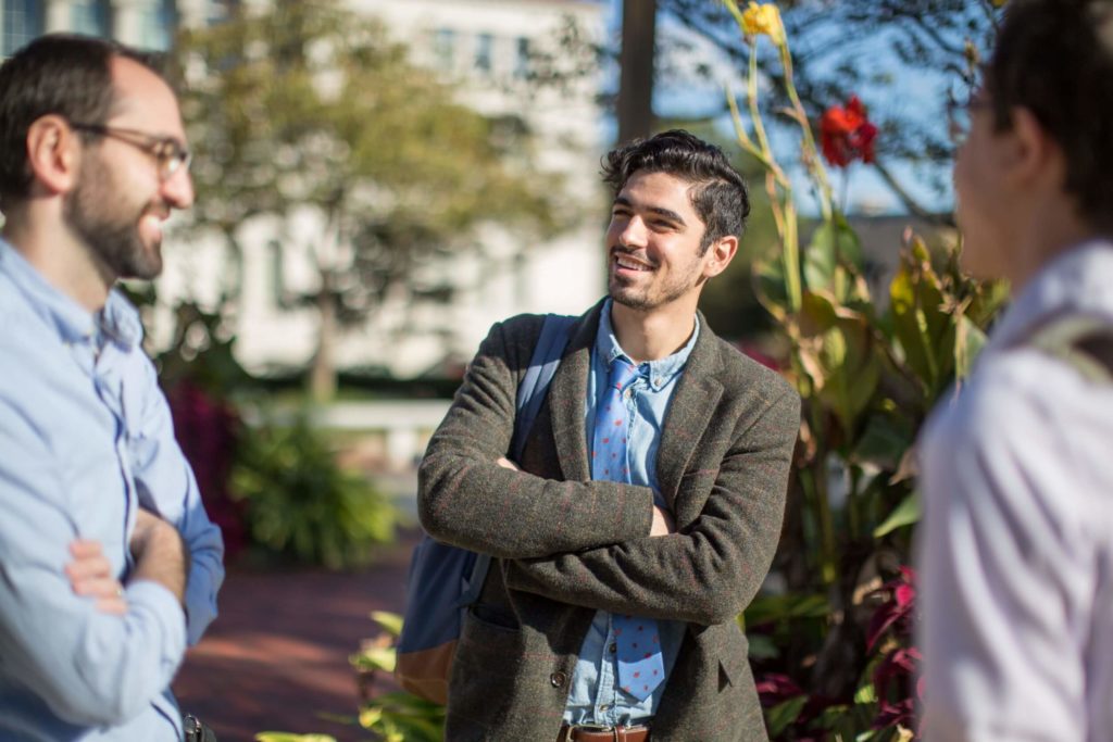 Students Smiling in the McGivney Hall courtyard